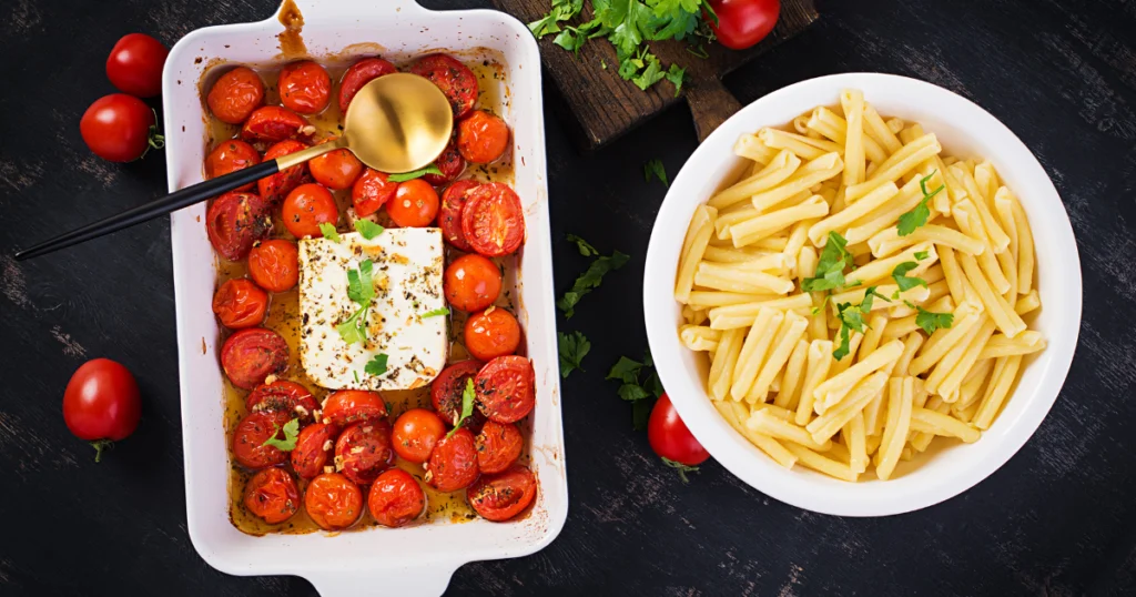 Baked Feta Pasta Dish with Cherry Tomatoes and Herbs